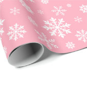 Weißes Schneeflockenmuster auf rosa Hintergrundfar Geschenkpapier (Rolleneckpunkt)