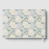 Weißfarbene Blume, hellblaues Gästebuch (Rückseite)