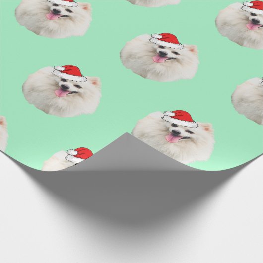 Weißpekingese mit Weihnachtsmannmütze Geschenkpapier (Ecke)