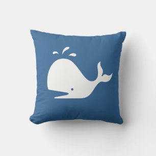 Weißwal aus CARTOON auf mittelblauem Kissen