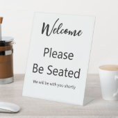 Welcome Please Be Seated White and Black Script Sockelschild (In SItu)