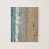 Welle und Fußabdrücke - Puzzle (Vertikal)