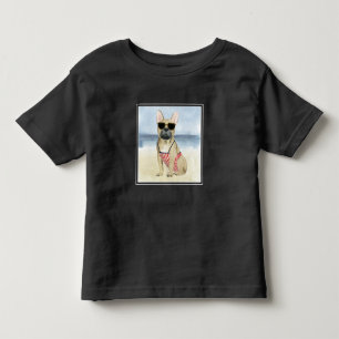 Welpe des Würstchen- in der Sonnenbrille am Kleinkind T-shirt
