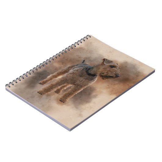 Welsh Terrier auf einem klappernden braunen Hinter Notizblock (Linke Seite)