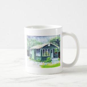 Wenig grünes Haus an der WeihnachtsTasse Kaffeetasse