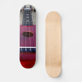 Wenig roter Ukulele Skateboard (Vorderseite)
