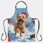 Wheaten Terrier läuft im Schnee mit Weihnachtshut Schürze (Vorderseite)