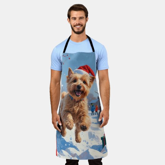 Wheaten Terrier läuft im Schnee mit Weihnachtshut Schürze (Getragen)