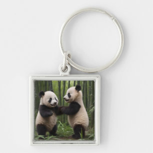 Whimsical Wonders: Baby Pandas spielt im Wald Schlüsselanhänger