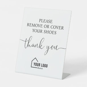 White Black Logo Realtor Entfernen Sie die Schuhe Sockelschild