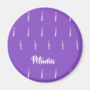 White candle on purple magnet