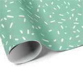 White Confetti Sprinkles on Green Geschenkpapier (Rolleneckpunkt)