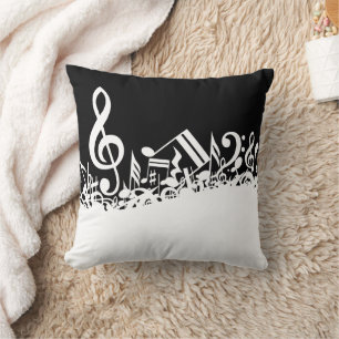 White Jumbled Musical Notes on Black Kissen