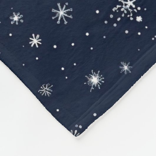 White Snowflakes on a Dark Blue Background Fleecedecke (Ecke)