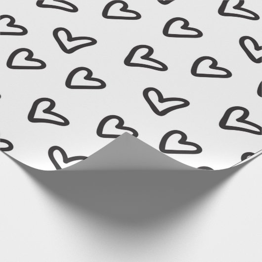 Whitepaper zum Umpacken von schwarzen Herzen Geschenkpapier (Ecke)