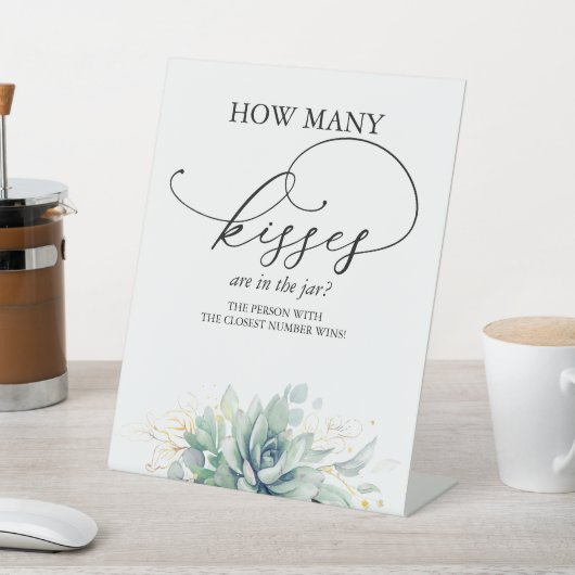 Wie viele Küsse sind im Glas? Sockelschild (In SItu)