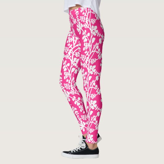 Wiederholtes Muster in Rosa und Weiß Leggings (Links)