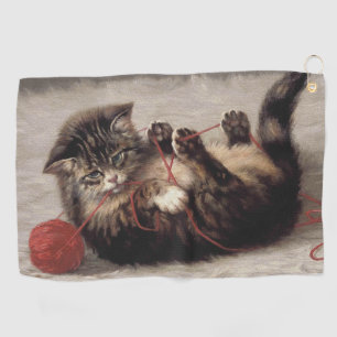 Wiegenlied der Katze, Eine Katze spielt mit einem Golfhandtuch