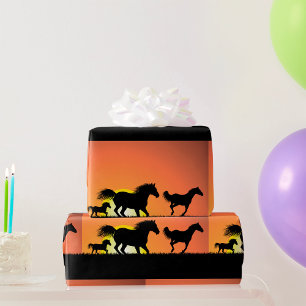 Wildpferde-Sonnenuntergangs-Silhouette Geschenkpapier