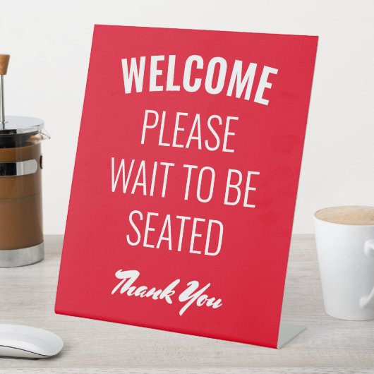 Willkommen Bitte warten Sie, um sich zu einem eige Sockelschild (In Situ)