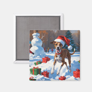 Windhund läuft im Schnee mit Weihnachtsmütze Magnet