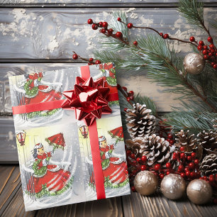 Windiger Weihnachtstag Mädchen rotes Kleid und Reg Geschenkpapier