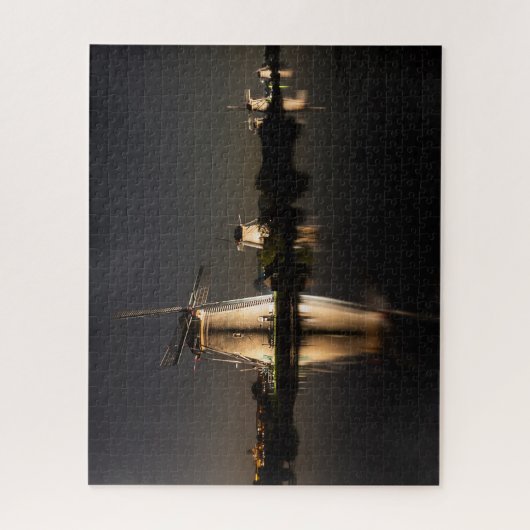 Windmills and water illuminated at night puzzle (Vertikal)