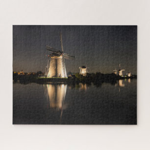 Windmills and water illuminated at night puzzle