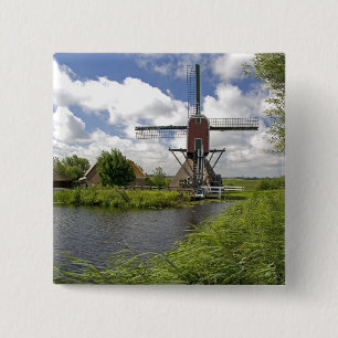 Windmühle entlang eines Kanals östlich von Leiden Button