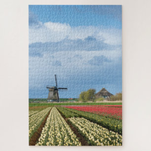 Windmühle und Tulpen in vertikaler Frühjahrslandsc Puzzle