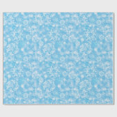 Winter-Schneeflocken auf hellblauem Geschenkpapier (Flach)