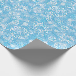 Winter-Schneeflocken auf hellblauem Geschenkpapier