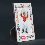 WinterFoto Fotoplatte<br><div class="desc">Auf JEDEM FARBHINTERGRUND (wir zeigen blau) zeigt Tabletop Foto Easel Ihr LieblingsFoto, umgeben von Schnee- und Winterschnee-Blume - Poinsettias, Beeren und Blätter. Ändern Sie das JAHR (unten rechts) oder es kann gelöscht werden. Gut als Geschenk oder um Ihr Lieblings-Foto in Ihrer eigenen Zuhause zu zeigen. Ihre Bildfarben werden direkt auf...</div>