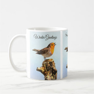 Wintergrüße. Rotkehlchen singt Kaffeetasse