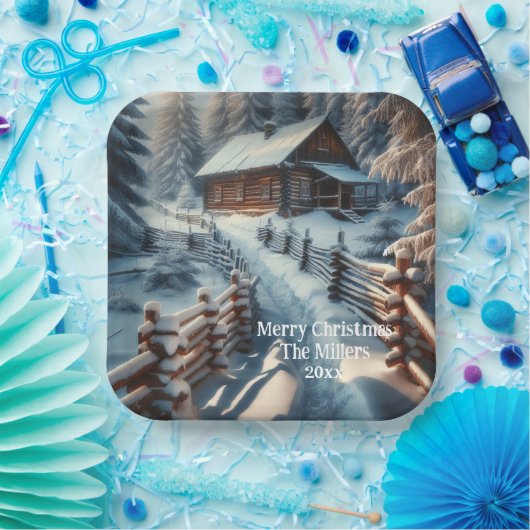 Winterlogmelkabine an einem schneebedeckten Weihna Pappteller (Party)