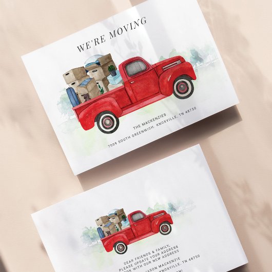 Wir bewegen den Vintagen roten LKW-Adresswechsel