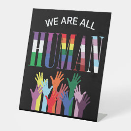 Wir sind alle menschliche farbenfrohe Hände Sockelschild