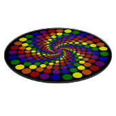 Wirbelndes Farbrad auf schwarzem Schneidebrett (Ecke)