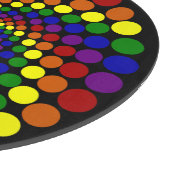 Wirbelndes Farbrad auf schwarzem Schneidebrett (Ecke)