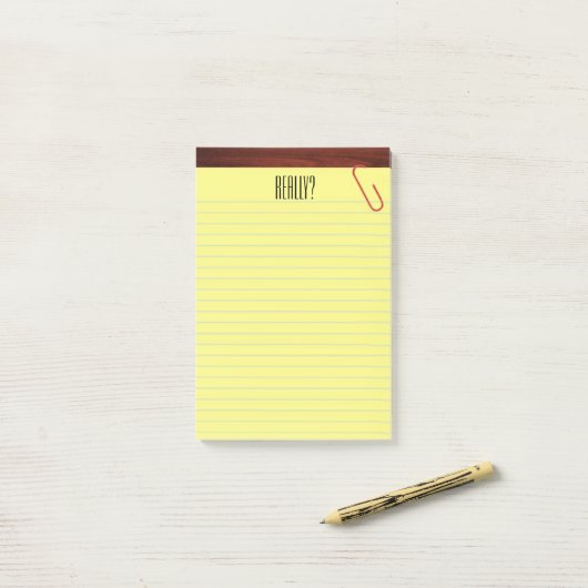 "Wirklich?" Kanzleibogenblock auf lustigem Post-it Klebezettel (Auf Schreibtisch)