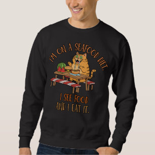 Witz über Meeresfrüchte-Diät – Hungrige Katze mit Sweatshirt