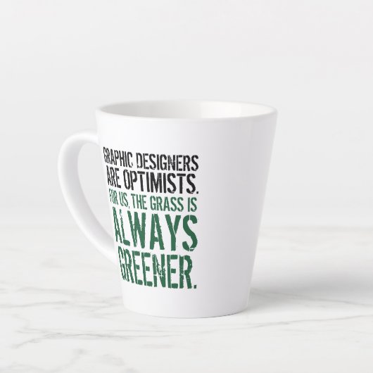 Witziges Zitat: Grafikdesigner sind Optimisten Milchtasse (Linke Ecke)