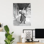 Woman holding a rifle on a porch poster (Heimbüro)