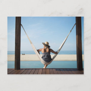 Woman Sitting On A Hammock At A Small Hotel Postkarte