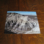 Wüstenlandschaft Blaues Mesa Badlands Foto Puzzle<br><div class="desc">Die hohen Wüstenberge des Blue Mesa Badlands im versteinerten Forest National Park bei Holbrook, Arizona verfügt über mehrere Ebenen von mehrfarbigen Felsen. In den Bergen gibt es viele Felsen und Risse, die mit Schatten gefüllt sind, die die Struktur der Felsformationen zeigen. Ein klarer blauer Himmel kontrastiert die Wüstenlandschaft. Um das...</div>