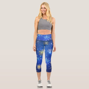 XMAS Blue Background mit goldenen Schneeflocken Capri Leggings
