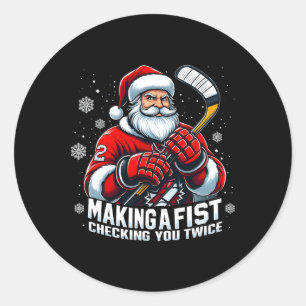 Xmas-Weihnachtsmann-Hockeyspieler, die eine Faust  Runder Aufkleber