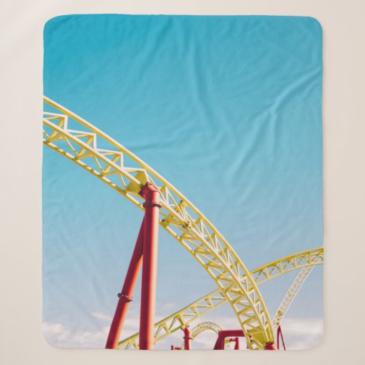 Yellow and red roller coaster under blue sky at da sherpadecke (Vorderseite)