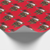 Yorkie Puppy mit einem Santa Claus-Hut Geschenkpapier (Ecke)