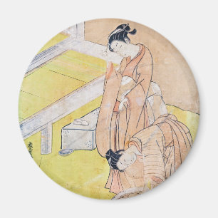 Young Girl wirft Goldfish in Pond-Magnete Magnet